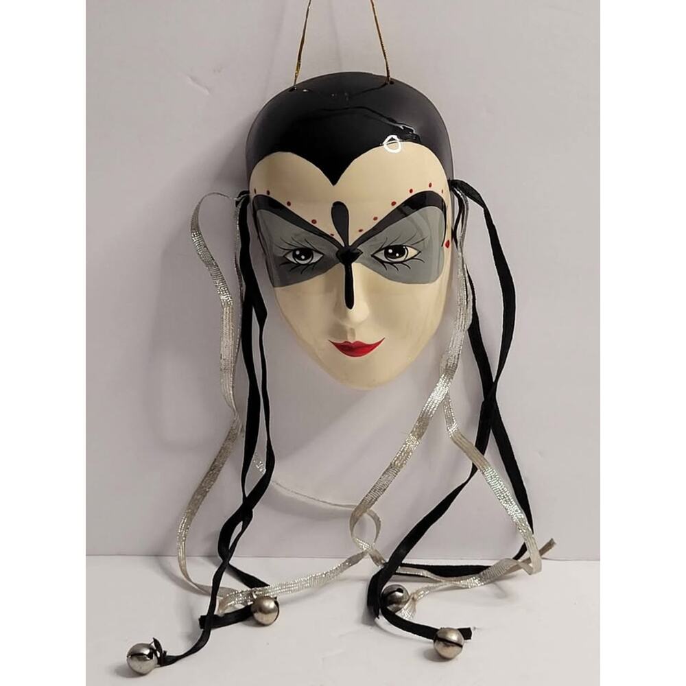 "Decorative Venetian-Style Mask with Ribbons and Bells."